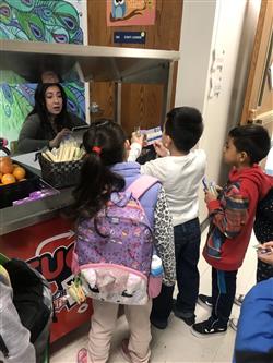 Students at a breakfast cart at Parkwood Elementary 